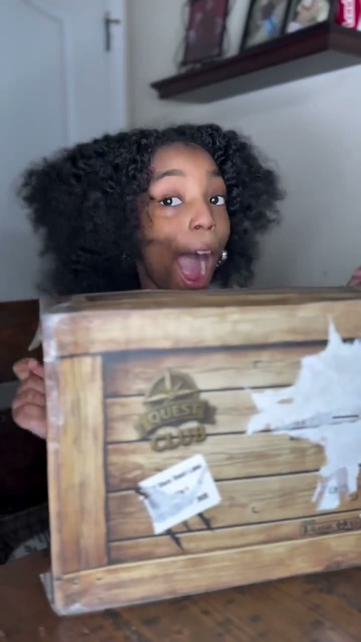 Londynn gasping as she opens her Quest Club crate