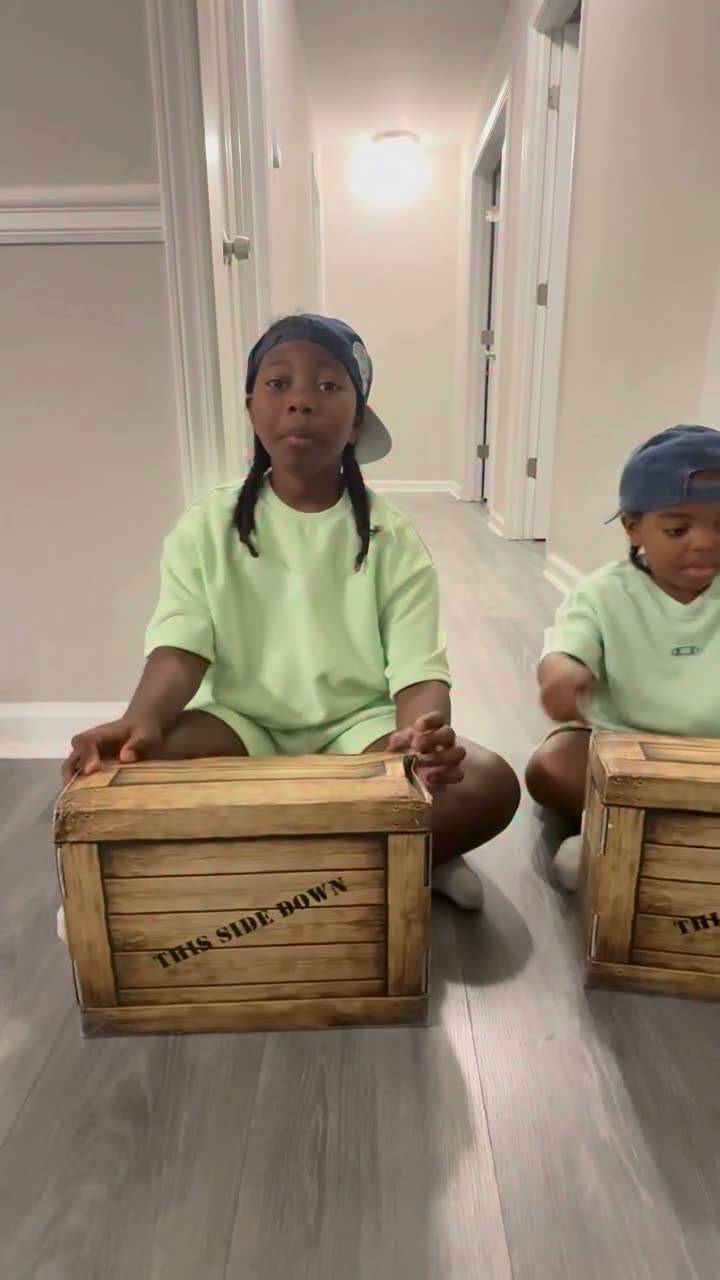 Brothers unboxing two Quest Club crates side by side